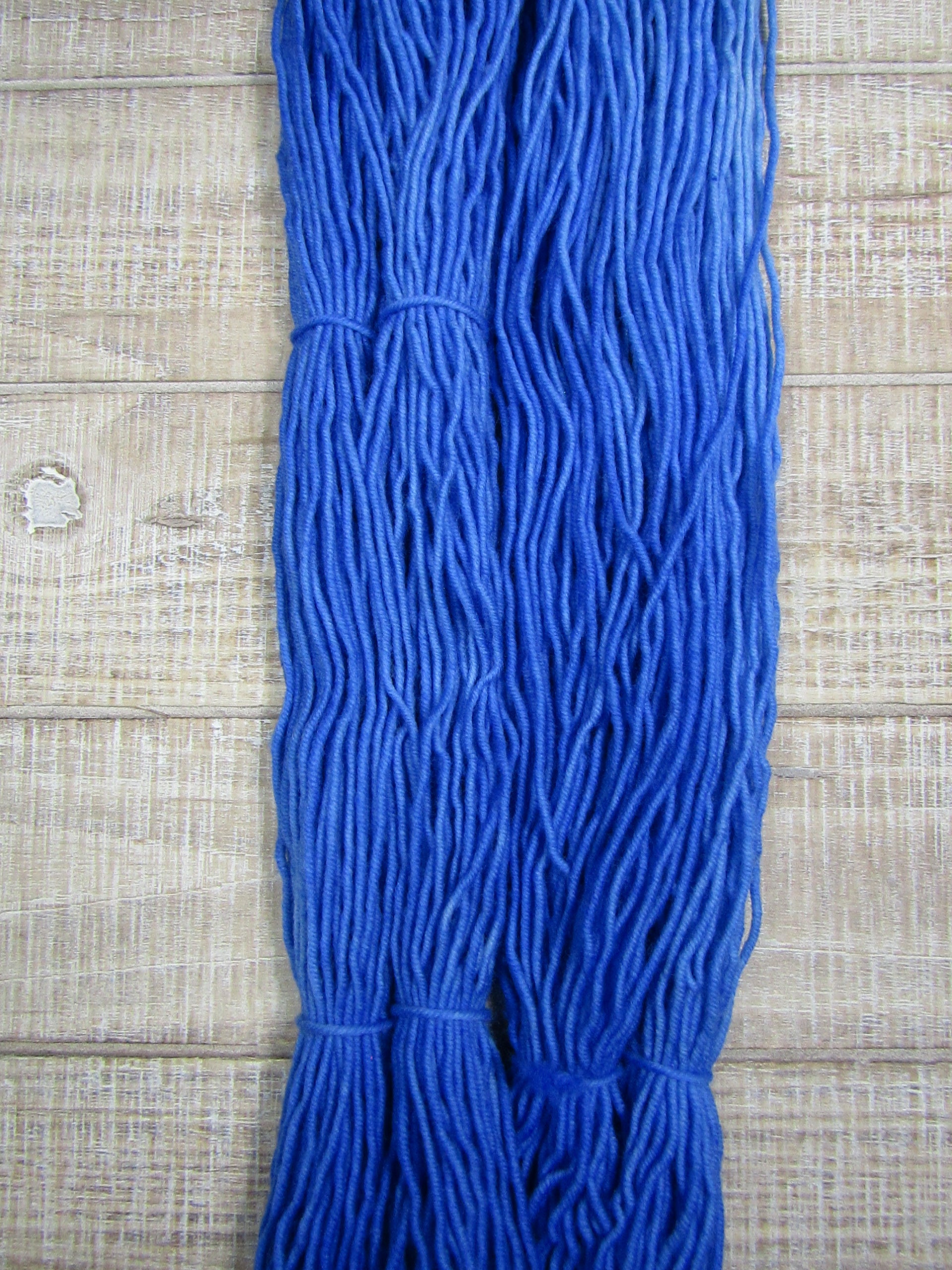 Hand-dyed yarn - Sapphire Merino/Cashstyle nylon worsted weight yarn in a sapphire blue color.