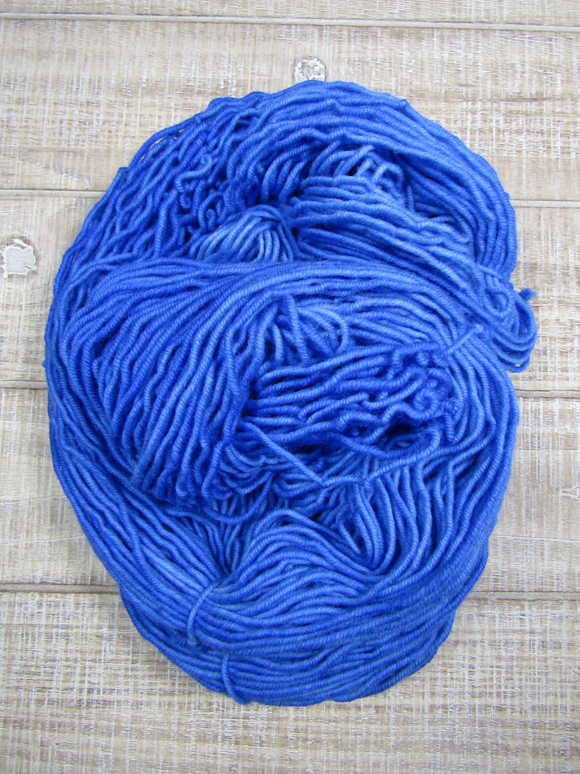 Hand-dyed yarn - Sapphire Merino/Cashstyle nylon worsted weight yarn in a sapphire blue color.