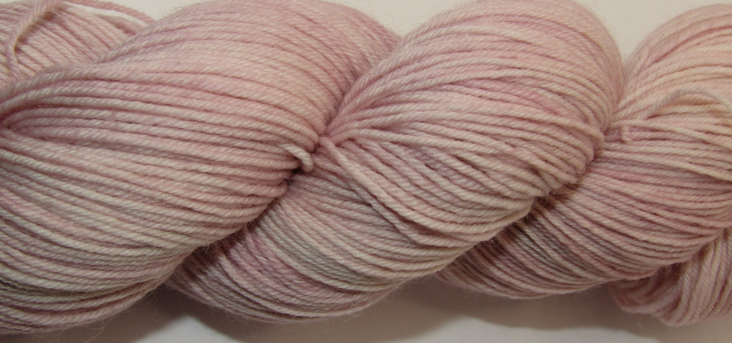Hand-Dyed Yarn Marilyn is a light mauve color.