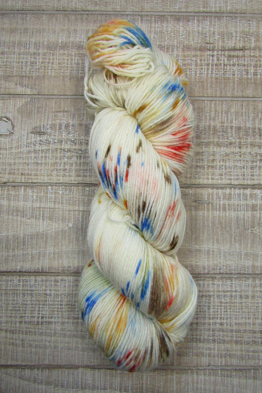 Hand-Dyed Yarn with speckles of brilliant blue, brown, orange, and salmon.Contents:  75% Superwash Merino Wool /