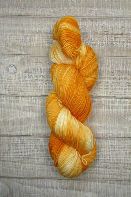 Hand-Dyed Yarn Ophelia is shades of orange and cream
