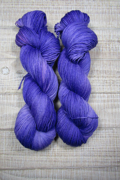 Hand-Dyed Yarn Superwash Merino/Nylon Fingering Weight Pansy shades of purple.